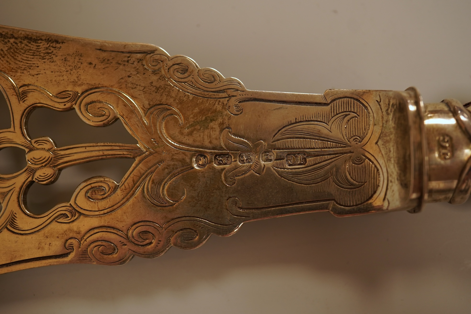 A pair of Victorian ornate silver fish servers, by John Gilbert, Birmingham, 1864, 34.1cm.